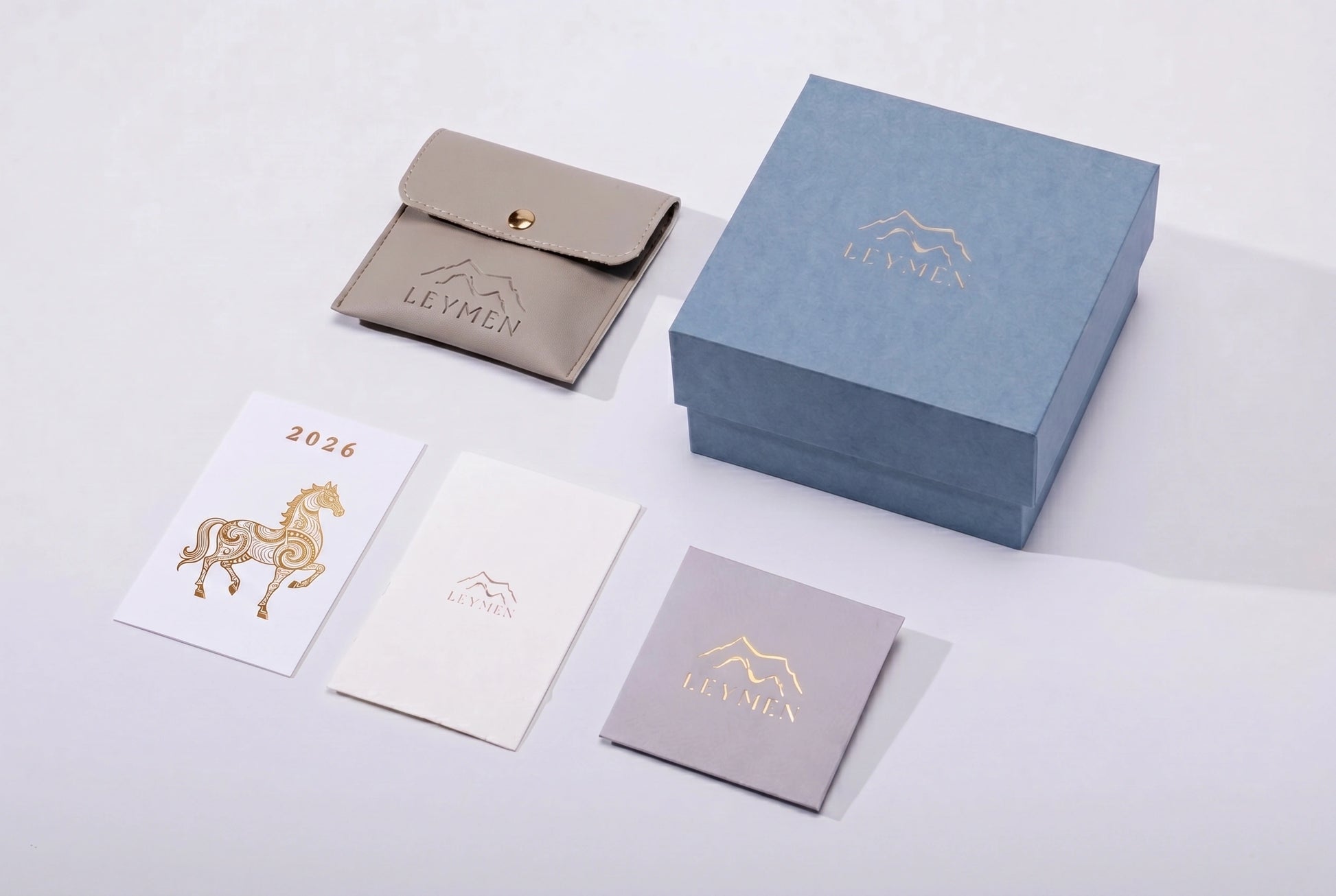 Leymen Jewels crystal bracelet premium packaging — blue gift box, leather pouch, and branded gift cards — Leymen Jewels
