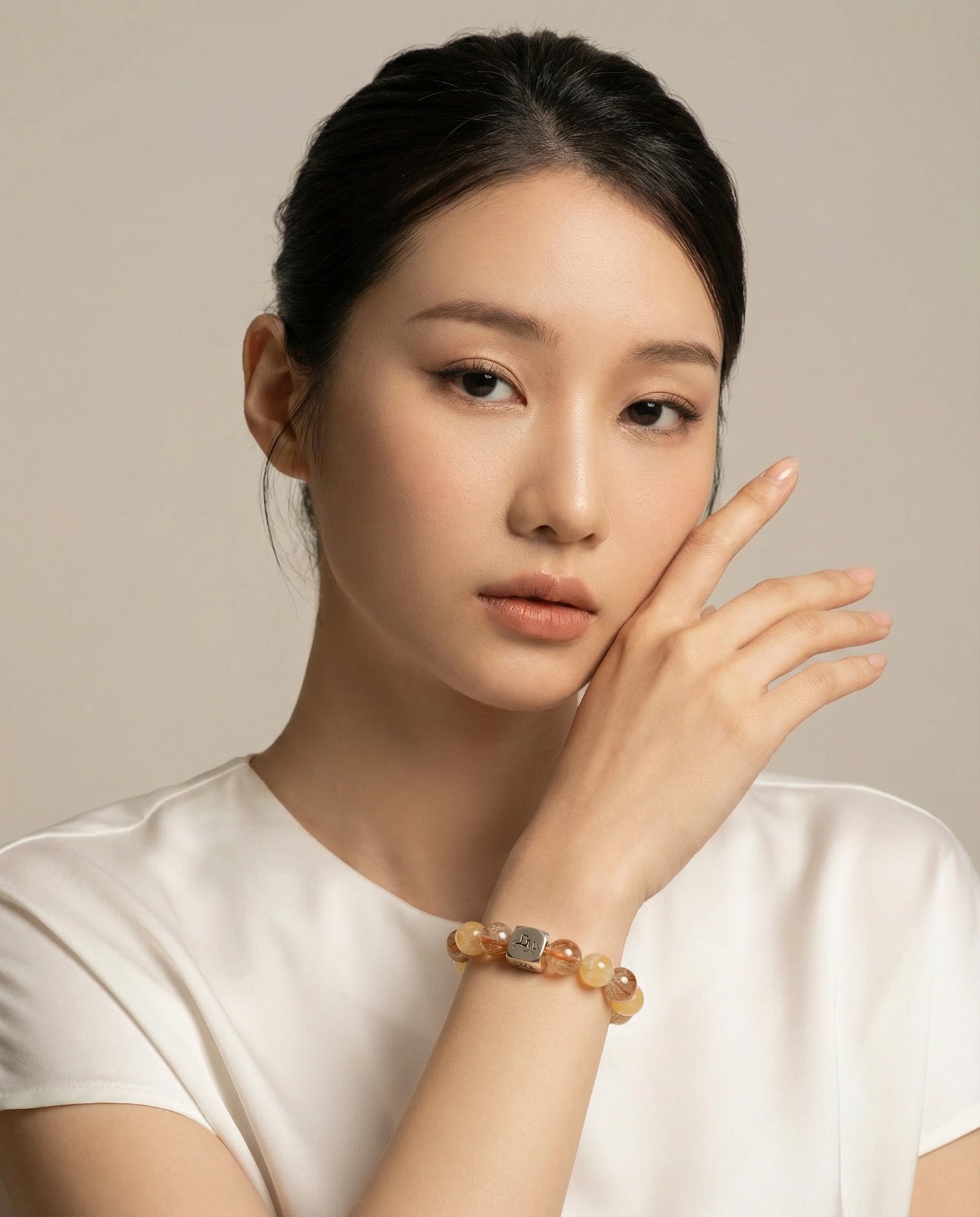 Leymen Jewels Earth element crystal bracelet in a contemplative model portrait, ancient wisdom for modern balance