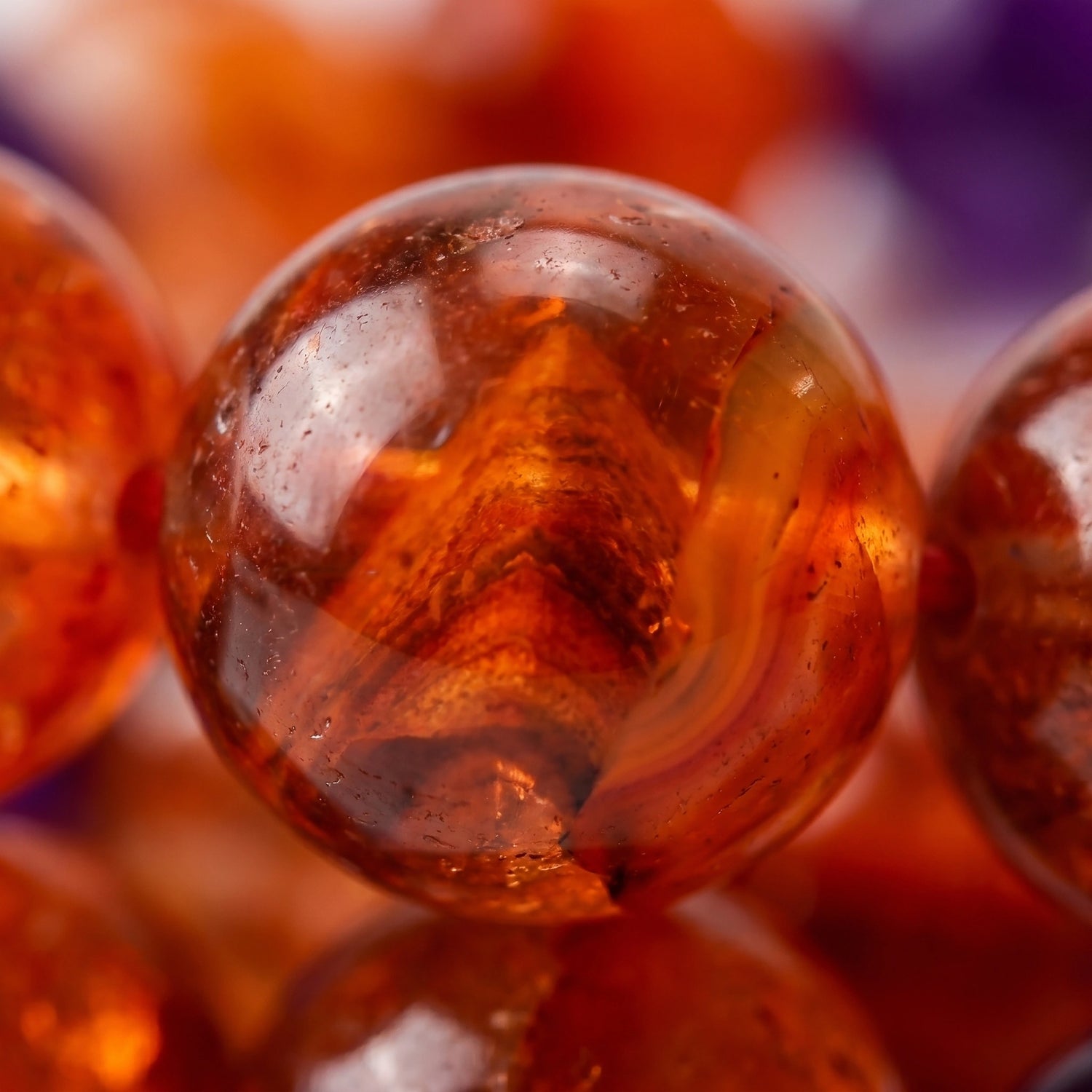 Ember fire crystal bracelet — red phantom quartz macro detail showing deep amber phantom formation within crystal — Leymen Jewels