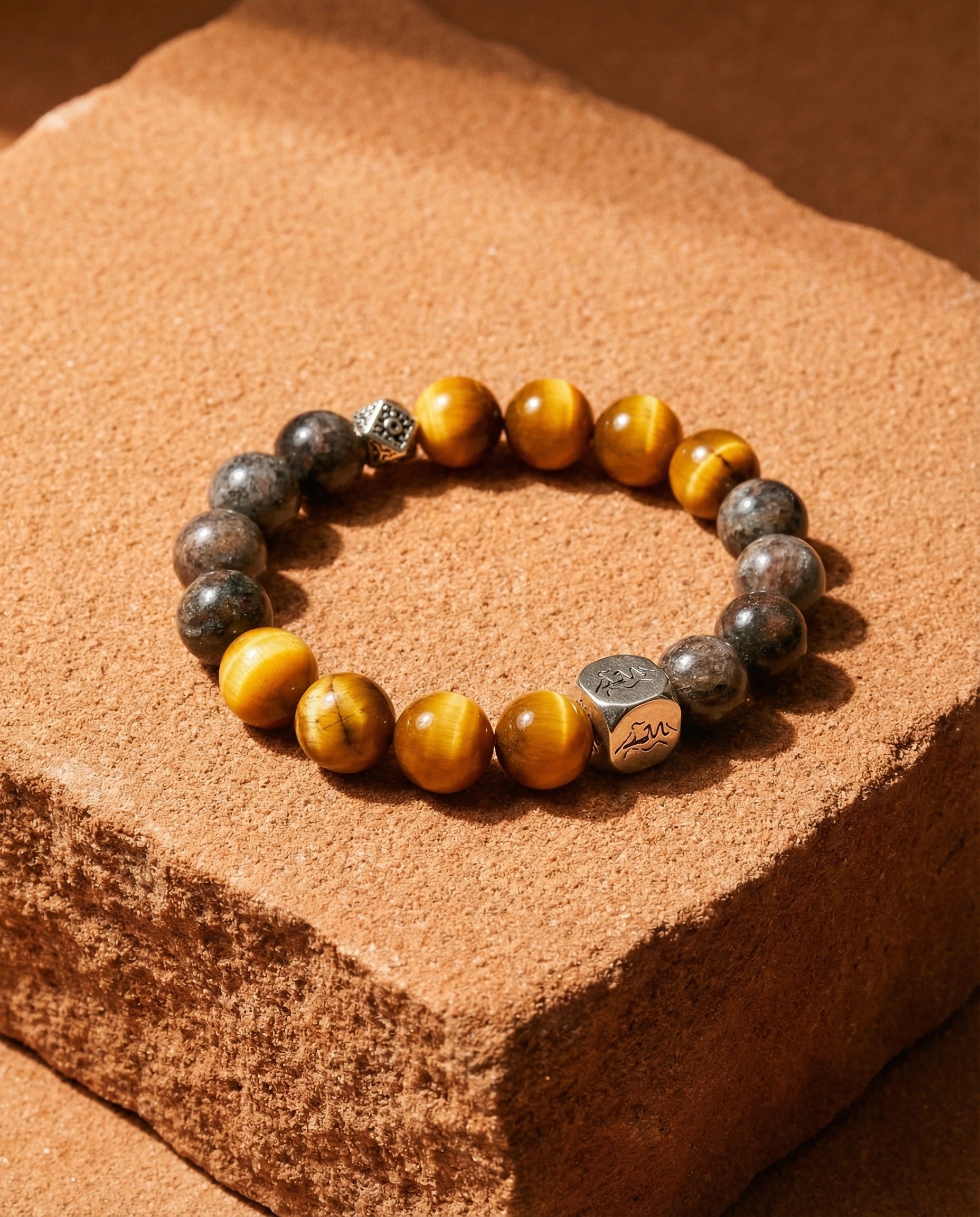 Foundation earth crystal bracelet — Tiger's Eye and Black Auralite-23 — on raw sandstone — Leymen Jewels