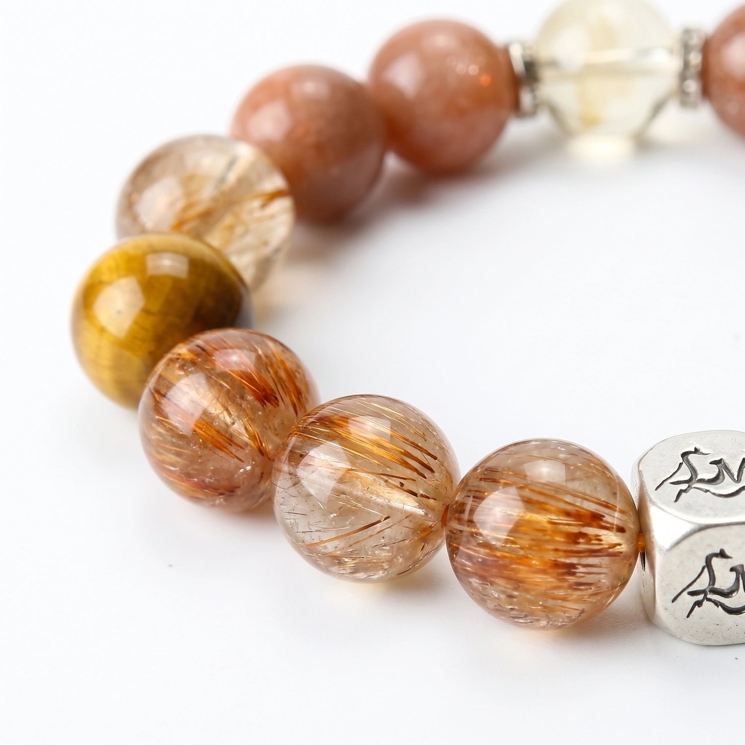 Ironflare Earth bracelet macro detail, Copper Rutilated Quartz, Sunstone, Citrine, and Tiger's Eye — Leymen Jewels