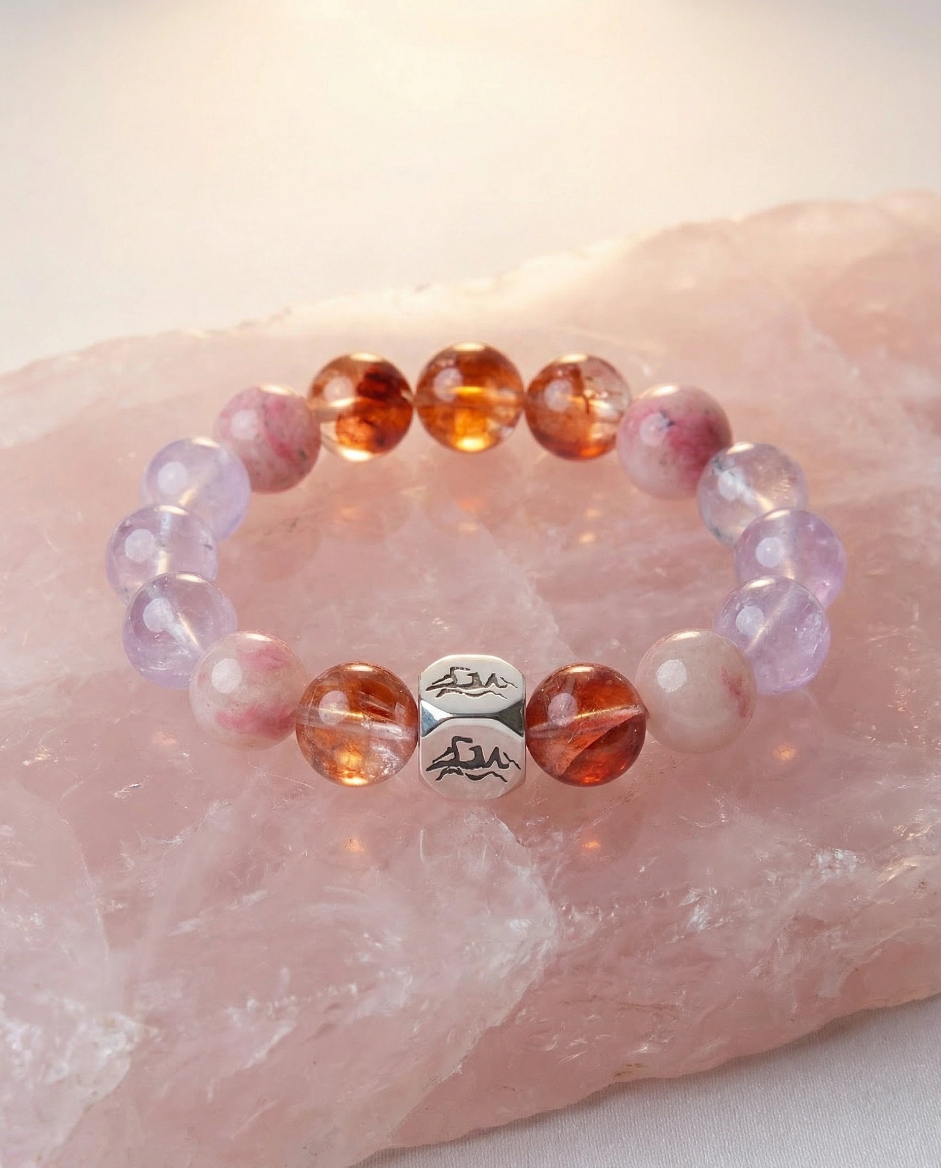 Kindle fire crystal bracelet — lavender amethyst and red phantom quartz — on raw rose quartz crystal — Leymen Jewels
