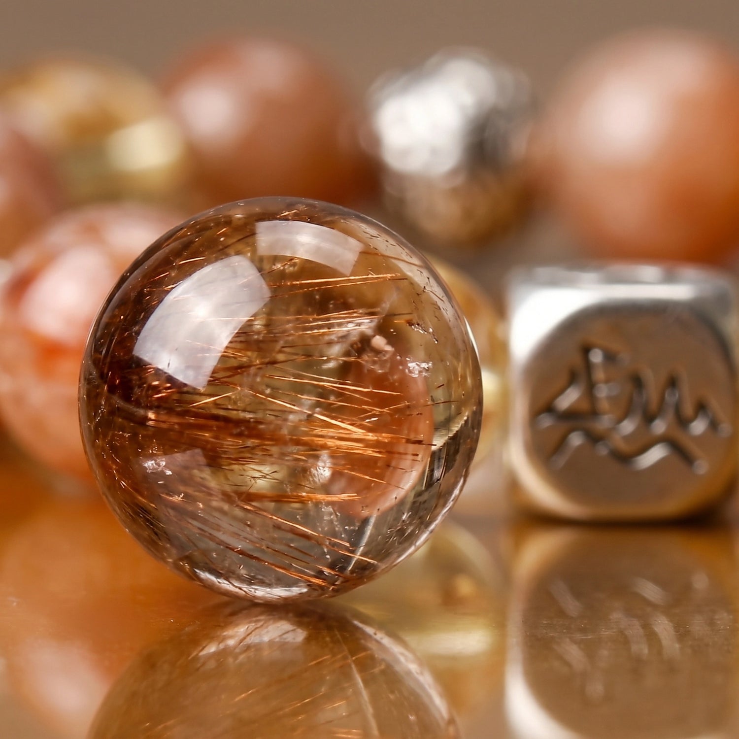 Radiance earth crystal bracelet — copper rutilated quartz macro detail showing fine copper needle inclusions — Leymen Jewels