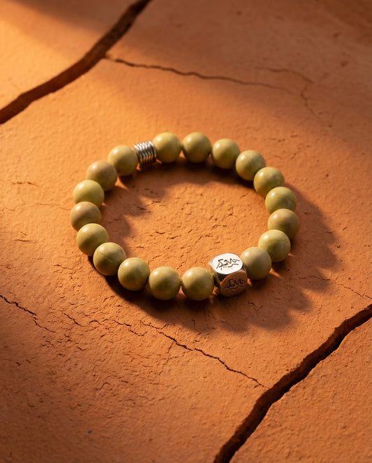 Sentinel earth crystal bracelet — blue pyrophyllite — on cracked terracotta earth — Leymen Jewels
