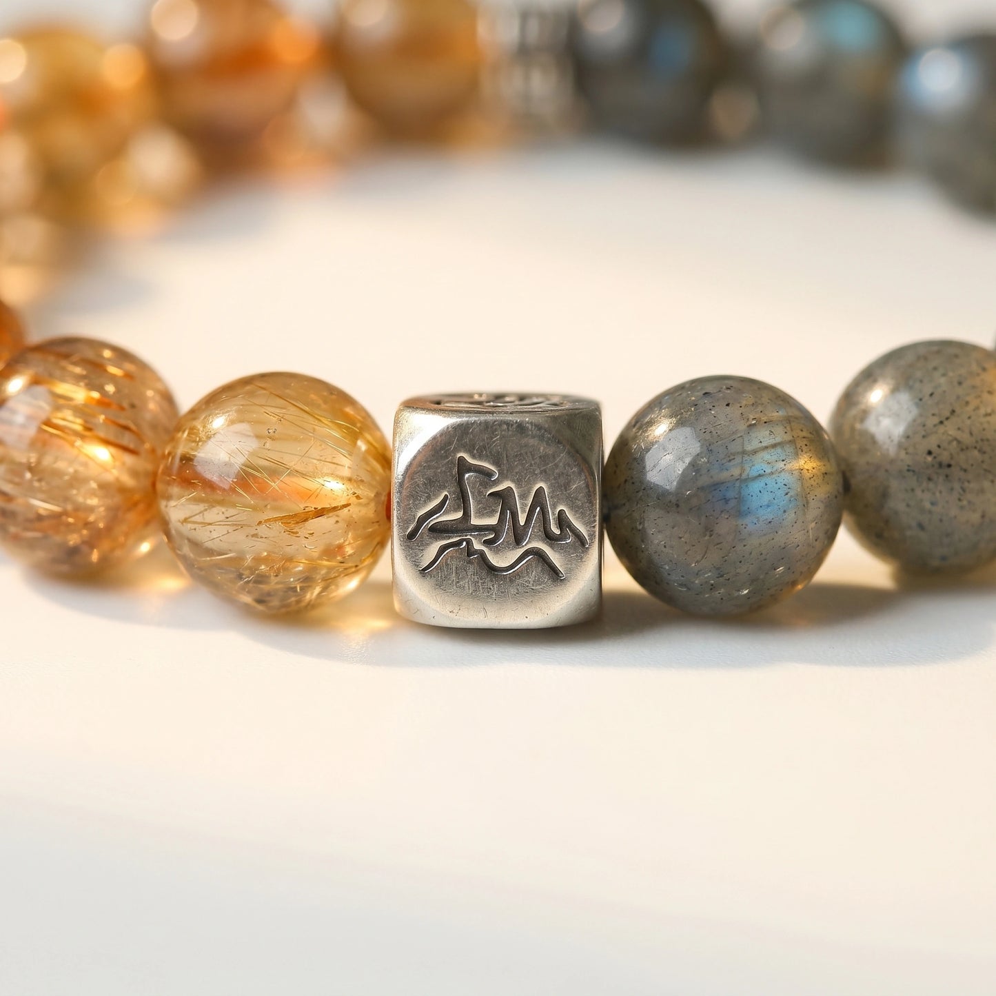 Solace metal crystal bracelet — copper rutilated quartz and grey moonstone macro detail — Leymen Jewels