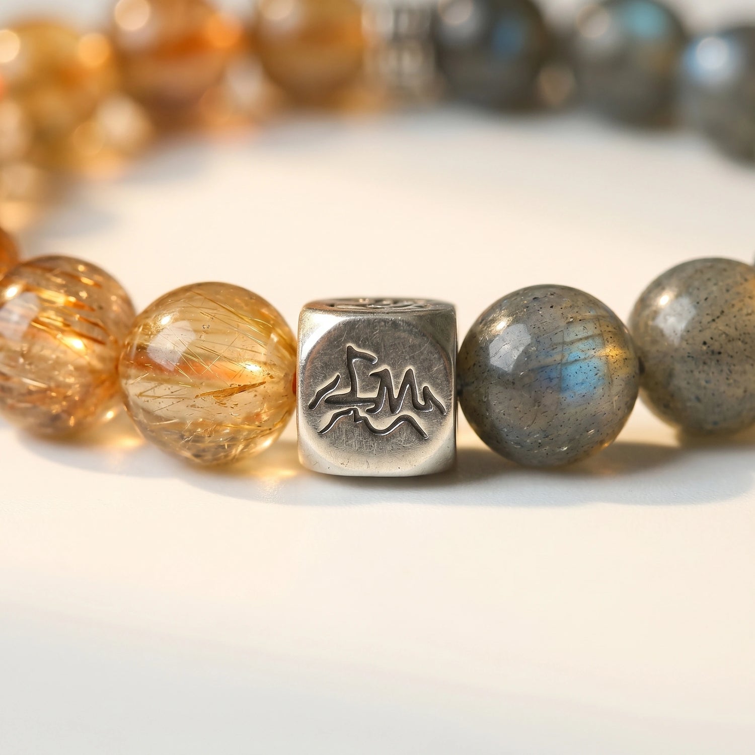 Solace metal crystal bracelet — copper rutilated quartz and grey moonstone macro detail — Leymen Jewels