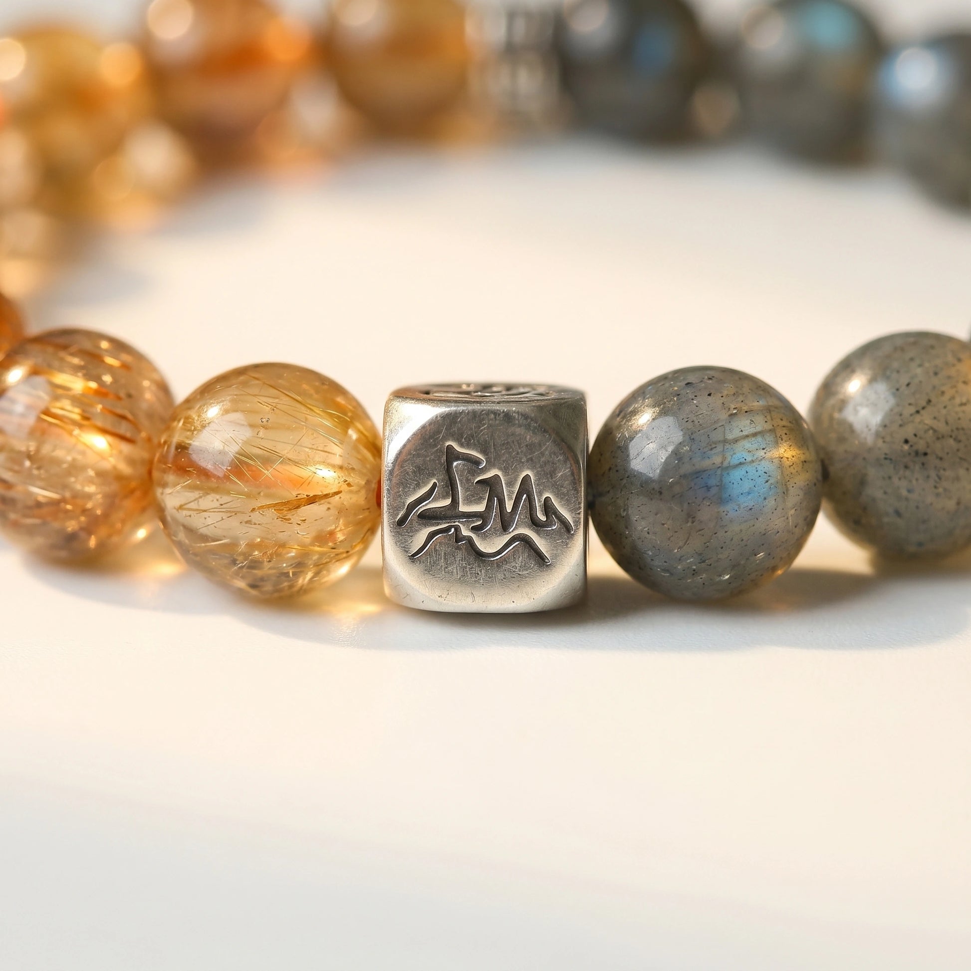 Solace metal crystal bracelet — copper rutilated quartz and grey moonstone macro detail — Leymen Jewels