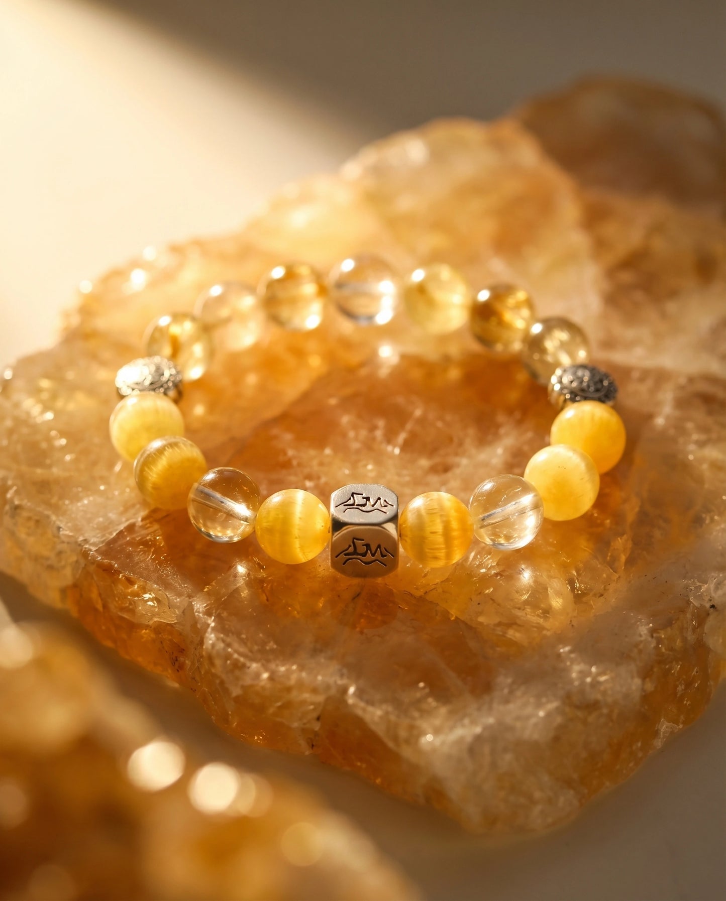 Solaris Vein earth crystal bracelet — citrine and golden rutilated quartz — on raw citrine cluster — Leymen Jewels