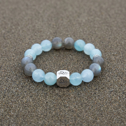 Tide water crystal bracelet — light aquamarine and grey moonstone — on wet ocean sand — Leymen Jewels