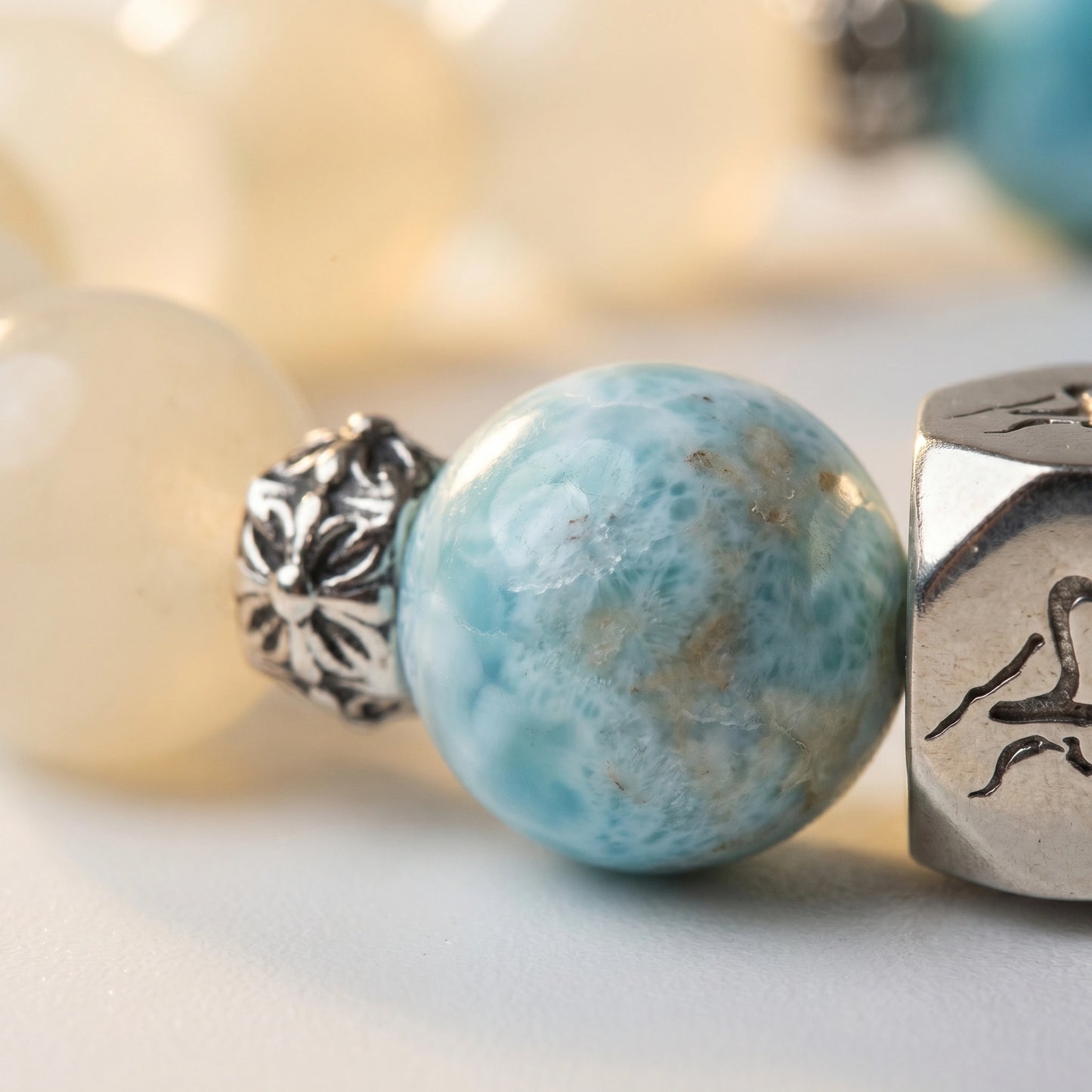 Tideborne water crystal bracelet — larimar macro detail showing sky-blue cloud patterned surface — Leymen Jewels