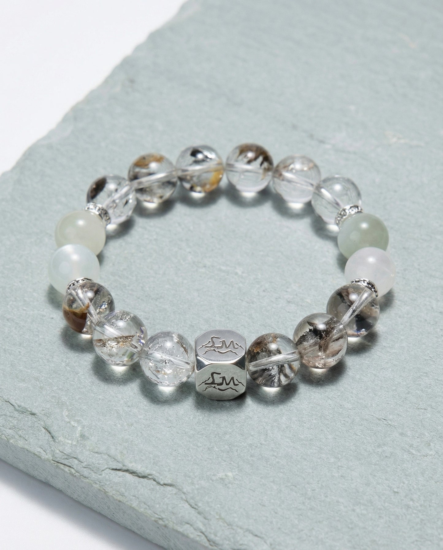 Verity metal crystal bracelet — herkimer diamond garnierite and snow quartz — on pale sage slate surface — Leymen Jewels