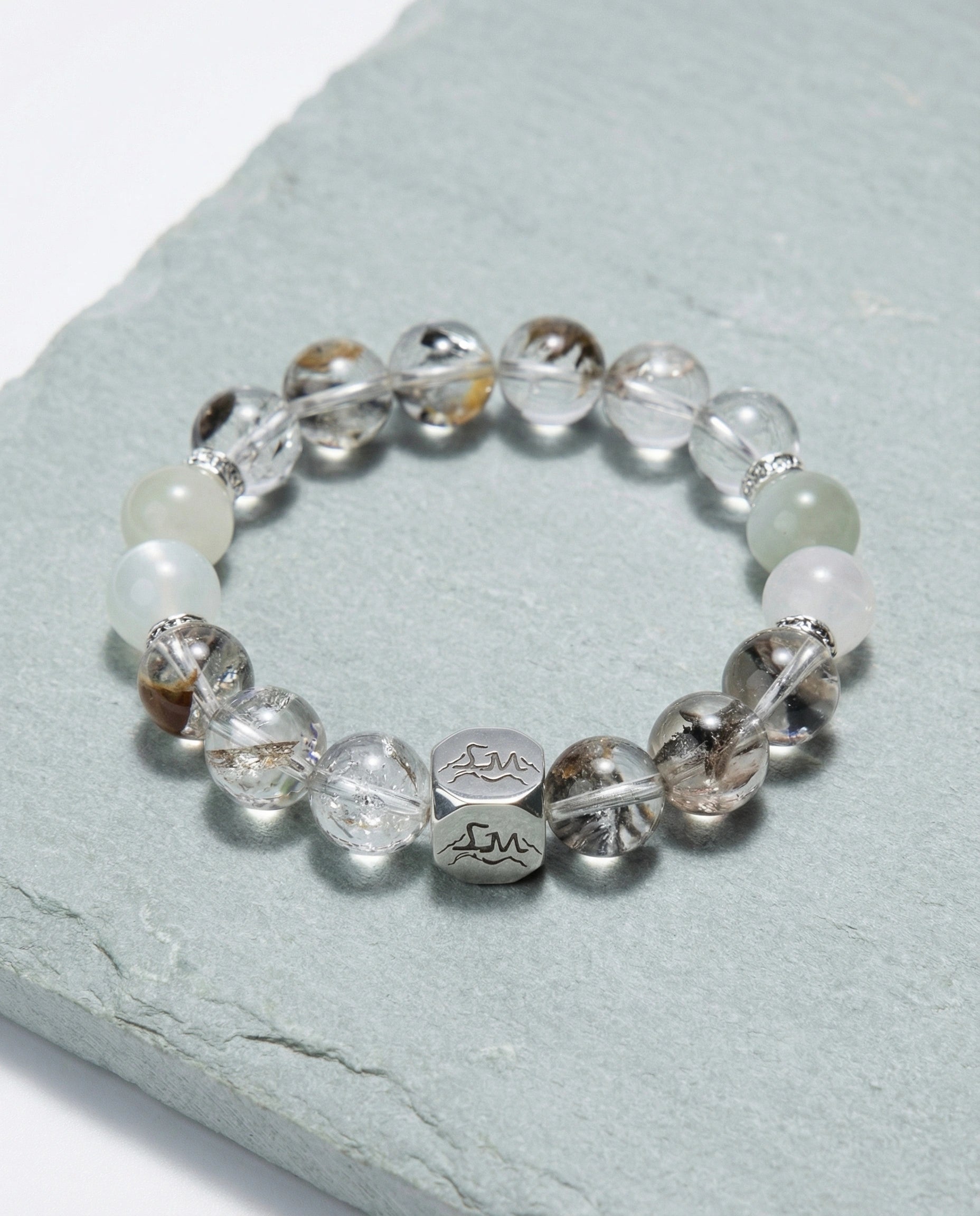 Verity metal crystal bracelet — herkimer diamond garnierite and snow quartz — on pale sage slate surface — Leymen Jewels
