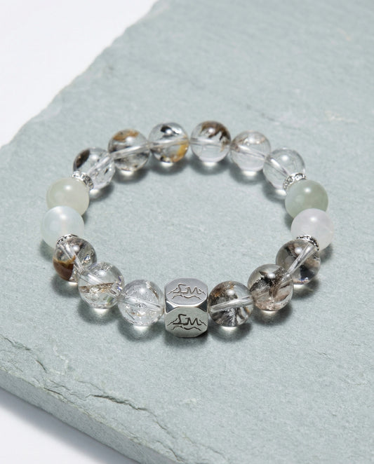 Verity metal crystal bracelet — herkimer diamond garnierite and snow quartz — on pale sage slate surface — Leymen Jewels